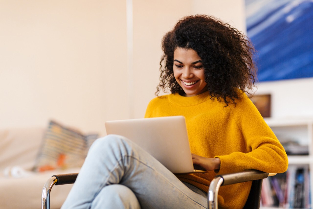 Woman sitting with laptop
