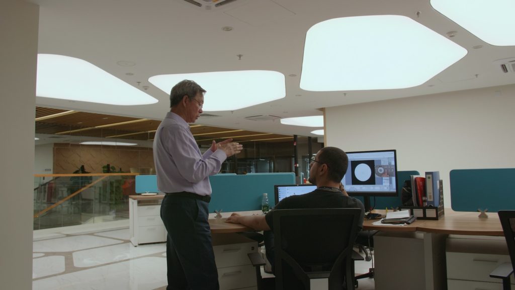 Standing, explaining workflow