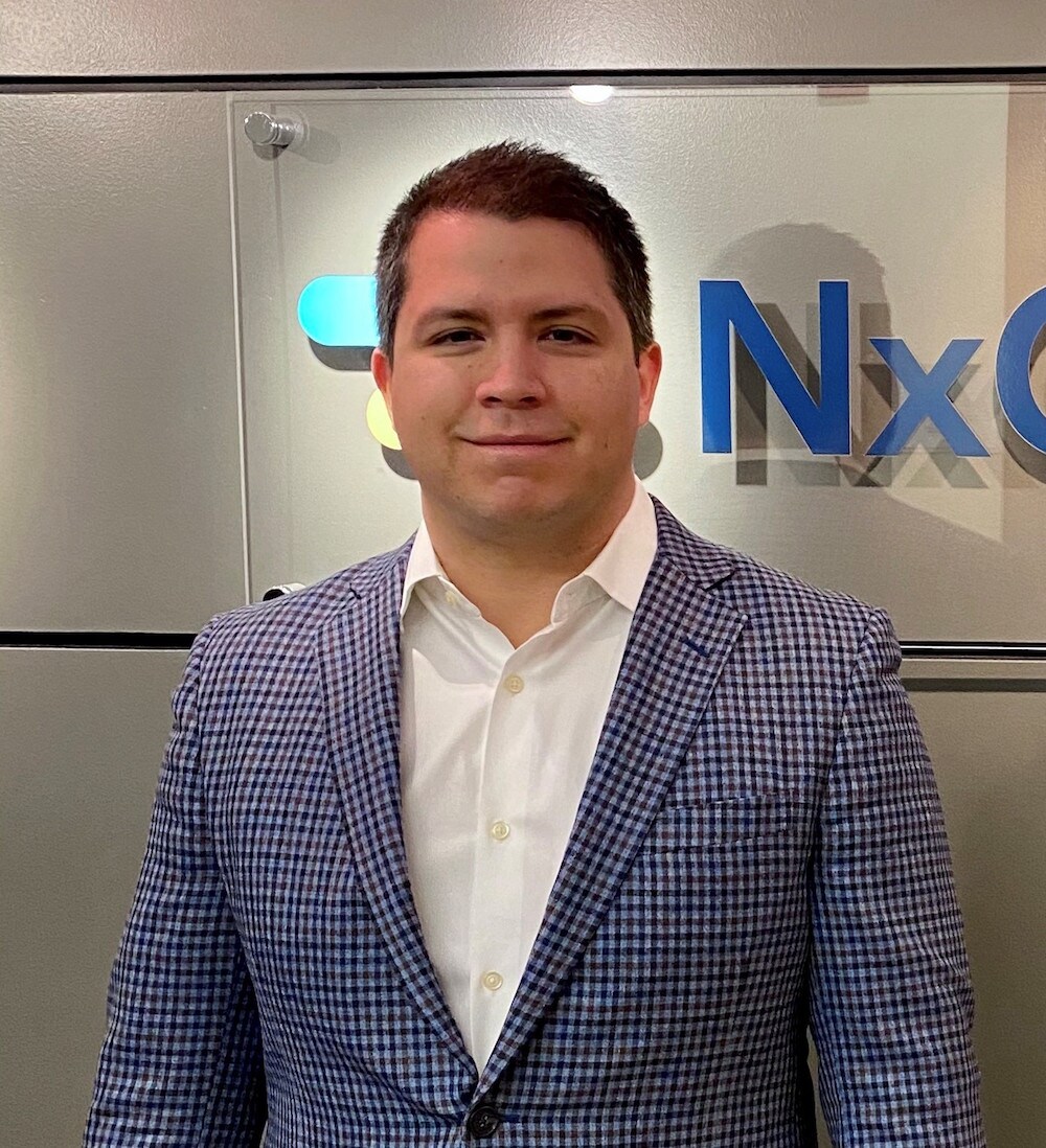 Adam Goodman of NxMdx, a man wearing a plaid blazer, explains his comparison of ReproSeq and VeriSeq
