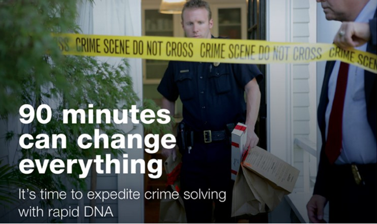 A police officer carrying a DNA testing kit exits a home with yellow crime scene tape across the door