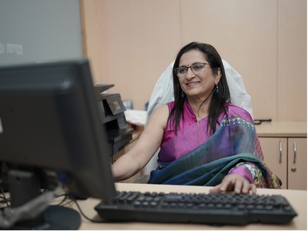 Dr. Chougule at her desk.