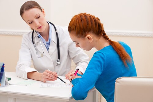 Doctor advises woman patient. Image: NotarYES/Shutterstock.com.