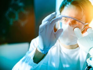 cell culture scientists holding vile