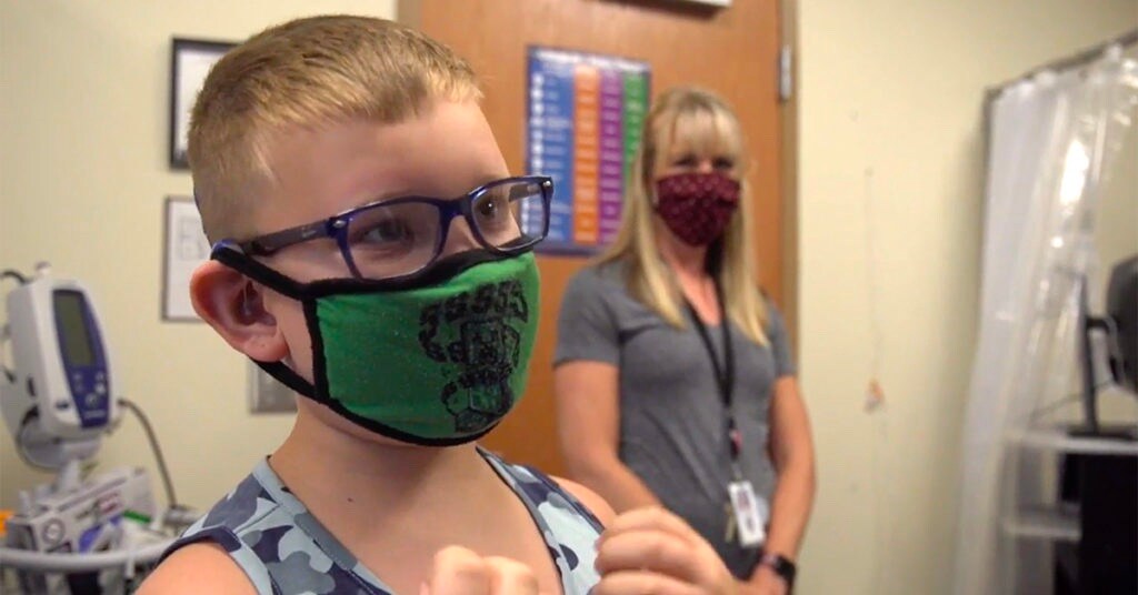 School boy with a mask on