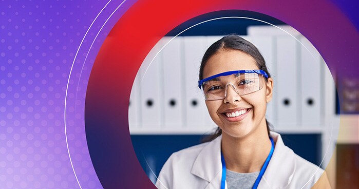 Scientist in laboratory wearing safety glasses, representing Thermo Fisher’s focus on lab compliance and validation services.