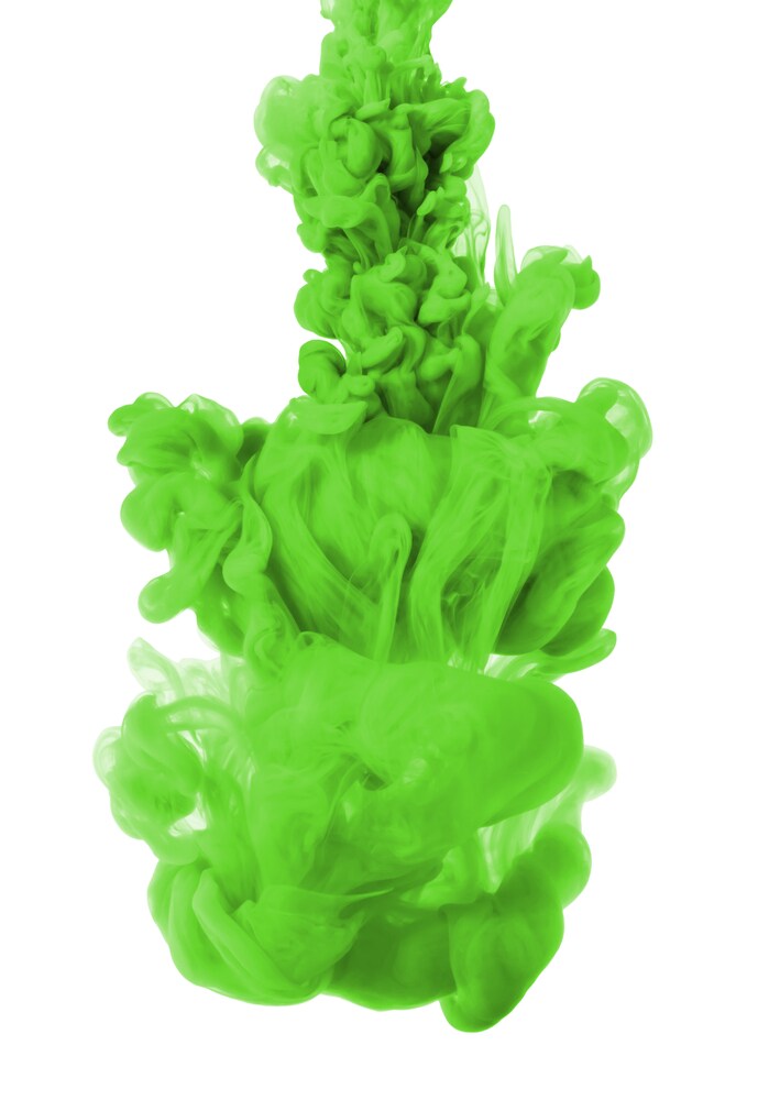 green ink in water, isolated on a white background