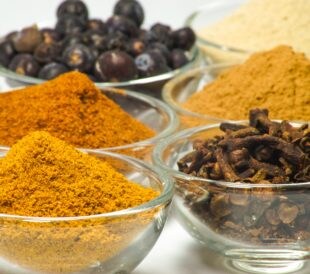 Bowls of colorful spices, which are commonly used in food fraud.