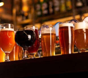 different types of beer on bar table