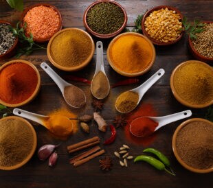 A selection of herbs and spices including Red and Green Chilli Turmeric Cumin Garam Masala making for savory cuisine