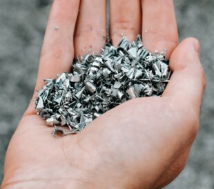 metal shavings in a person's hand