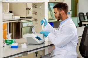 Researcher using NanoDrop Lite Plus Spectrophotometer