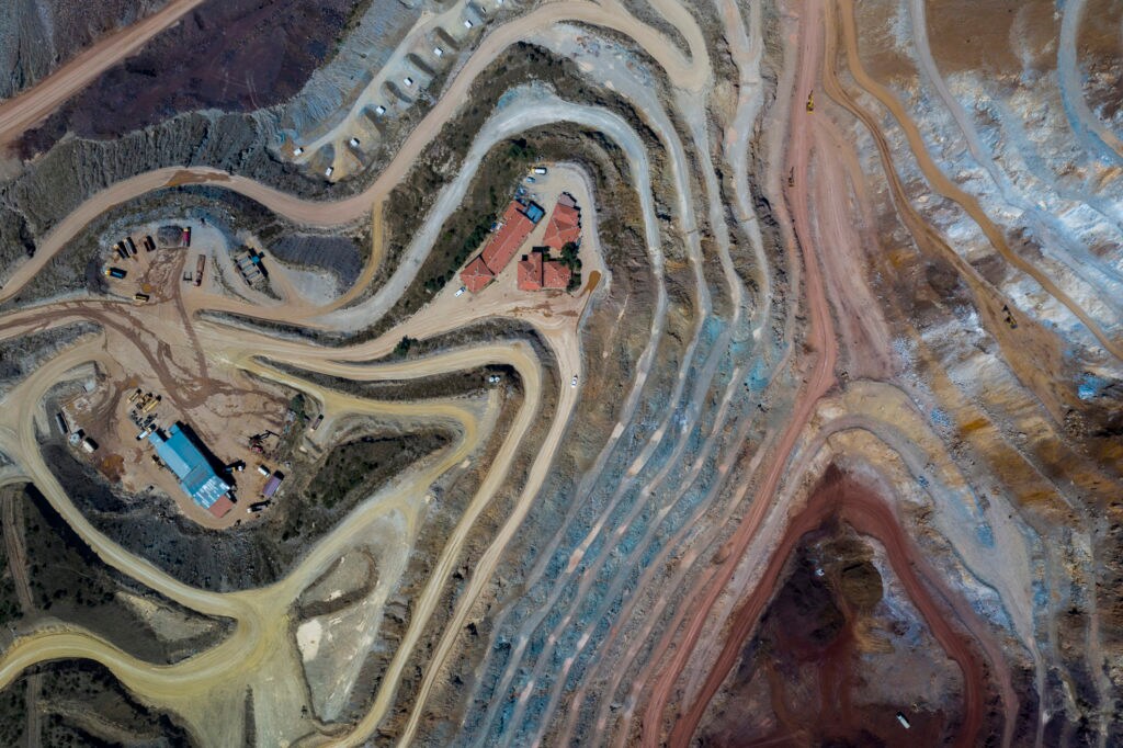 Aerial Wiev of Open-pit iron mine and office buildings. Taken via drone