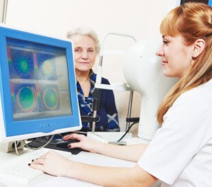 Optometry concept. Female optometrist optician doctor evaluate eyesight of female patient in eye ophthalmological clinic. Image: Dmitry Kalinovsky/Shutterstock.com.