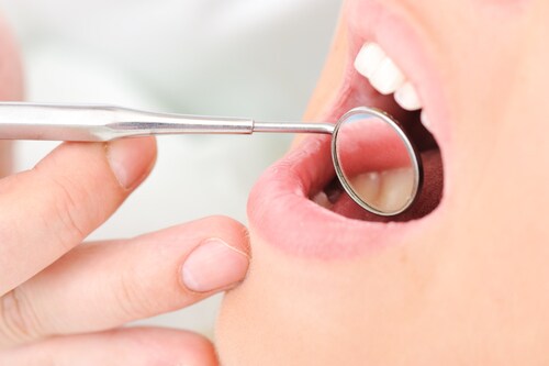 Teeth checkup at dentist's office. Image: Zurijeta/Shutterstock.com.