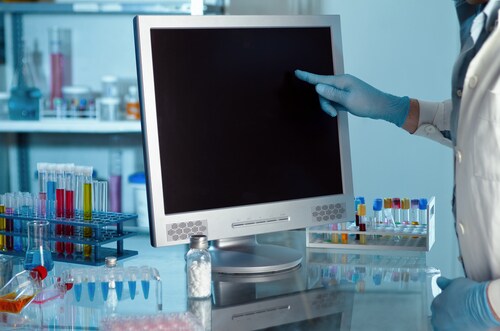 Scientist working with computer in a lab. Image: angellodeco/Shutterstock.com