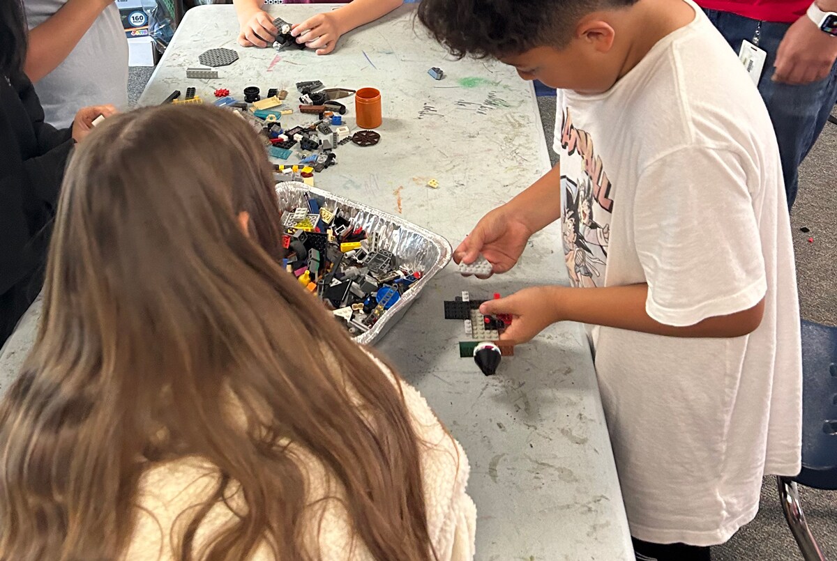 Students at a Carlsbad, CA elementary school build block airplanes