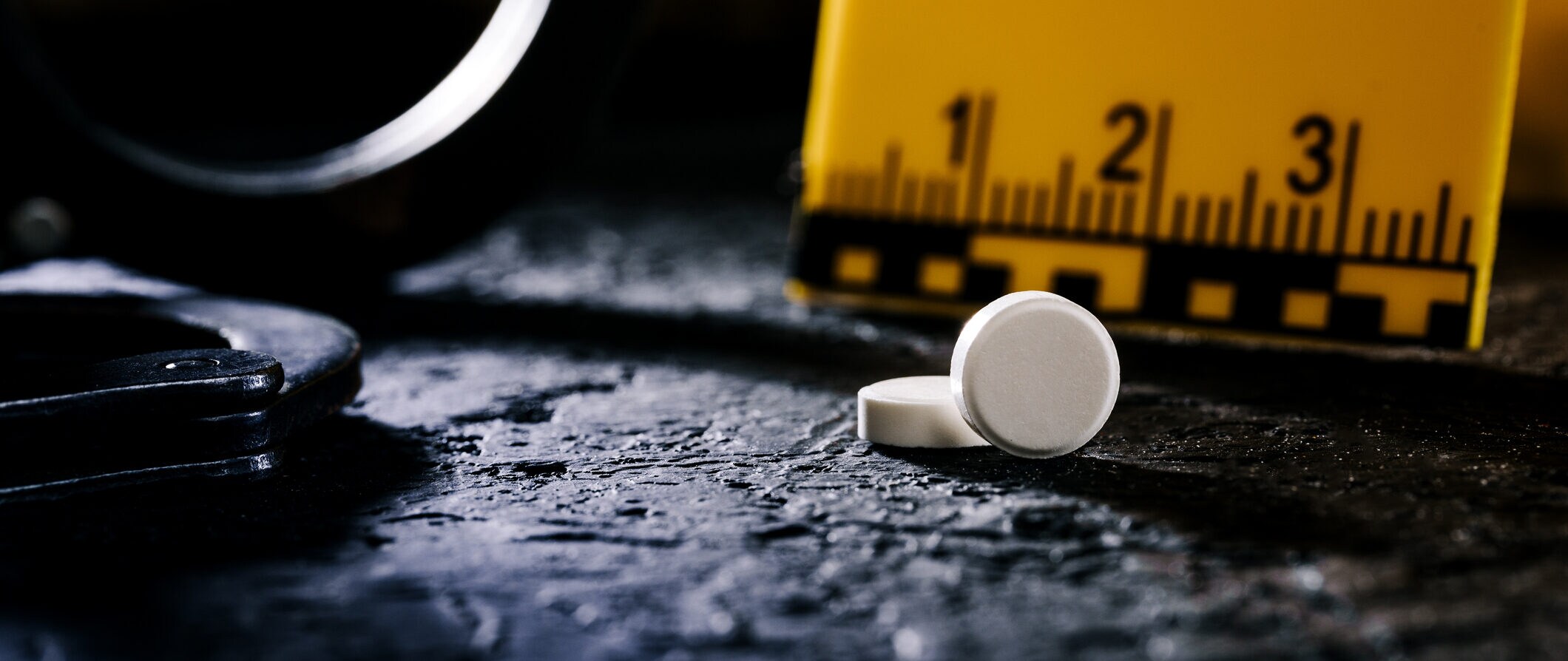 Handcuffed, drugs with handcuffs, the concept of drugs and crime