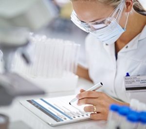 Scientist using LIMS on a tablet