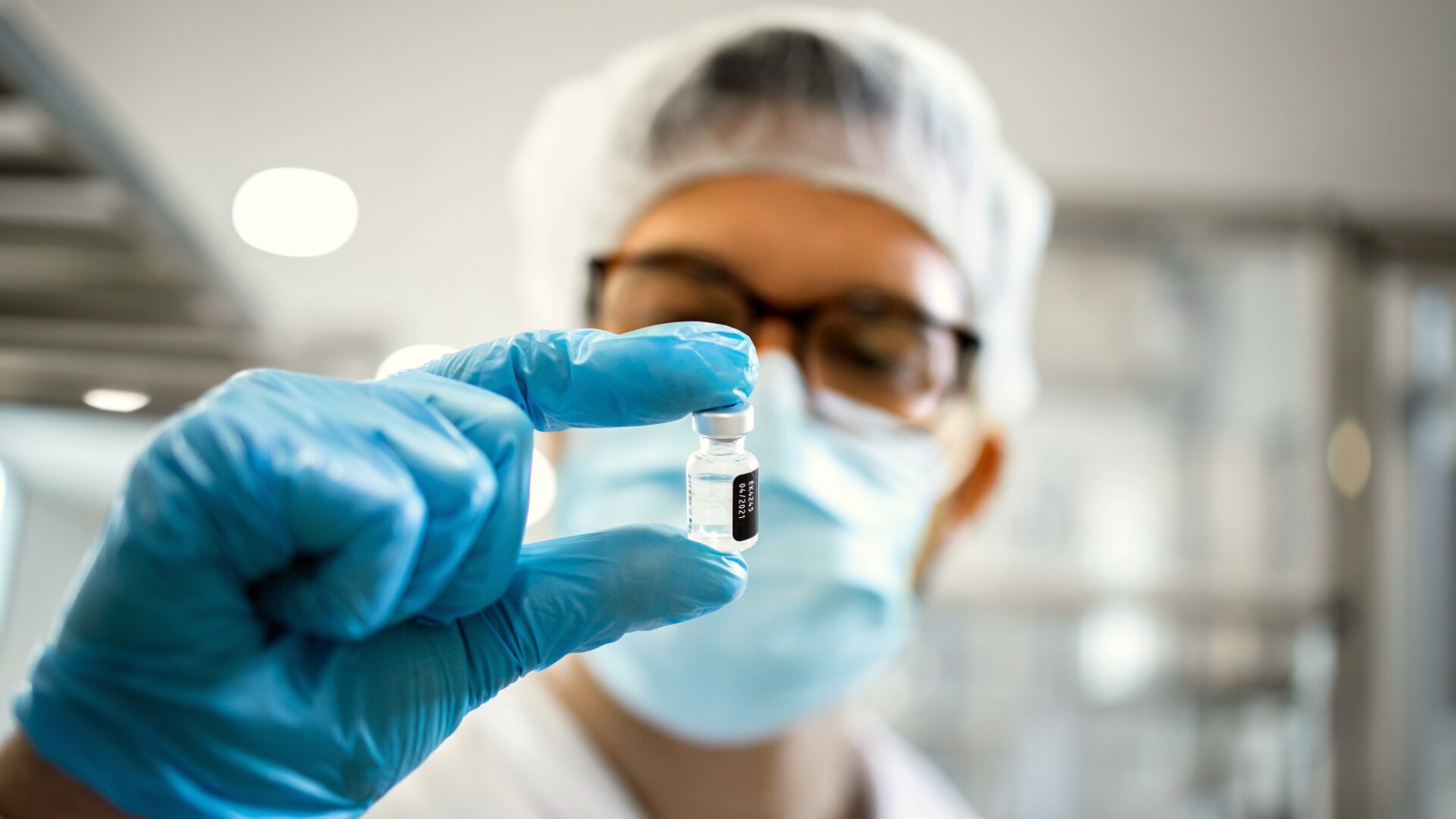 lab-tech-holding-vial