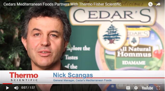 Still from video showing general manager of Cedar's Mediterranean Foods.