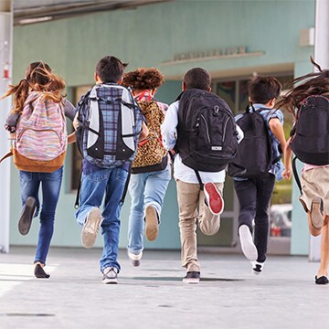 Kids run into school Elementary kids return to school this fall